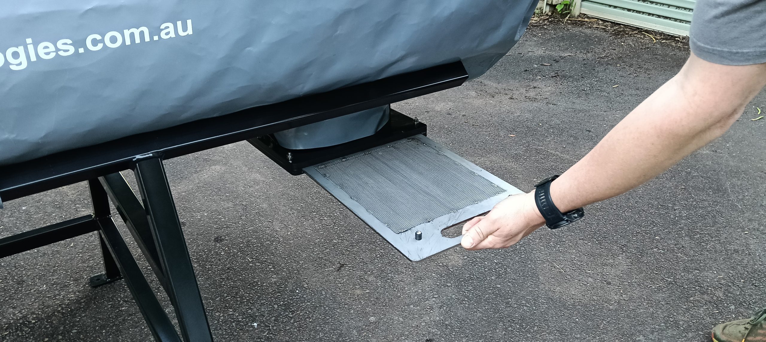 OSCA composter discharge vent open showing organic waste processing system outlet for sustainable composting operations