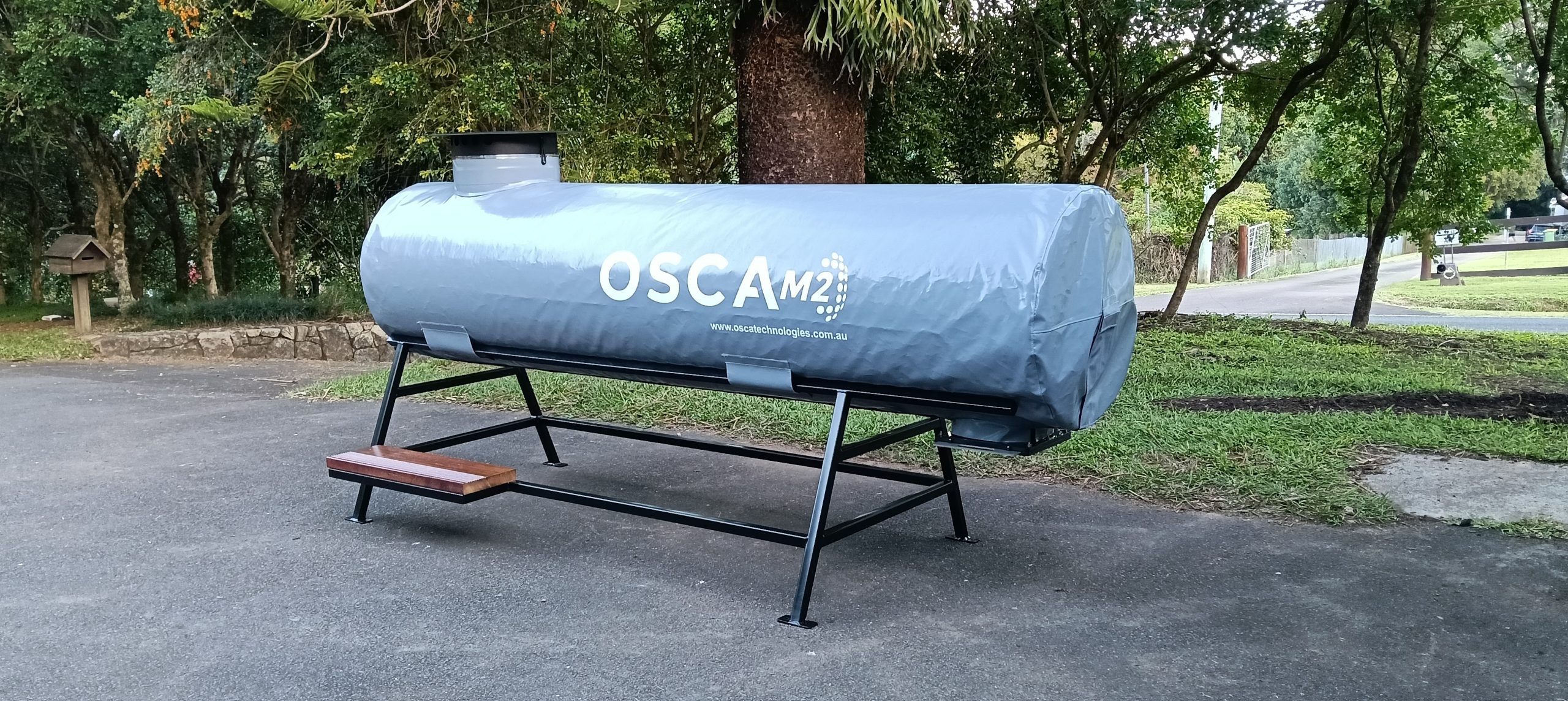 OSCA composter side and rear view showing cylindrical tank design and industrial composting equipment structure